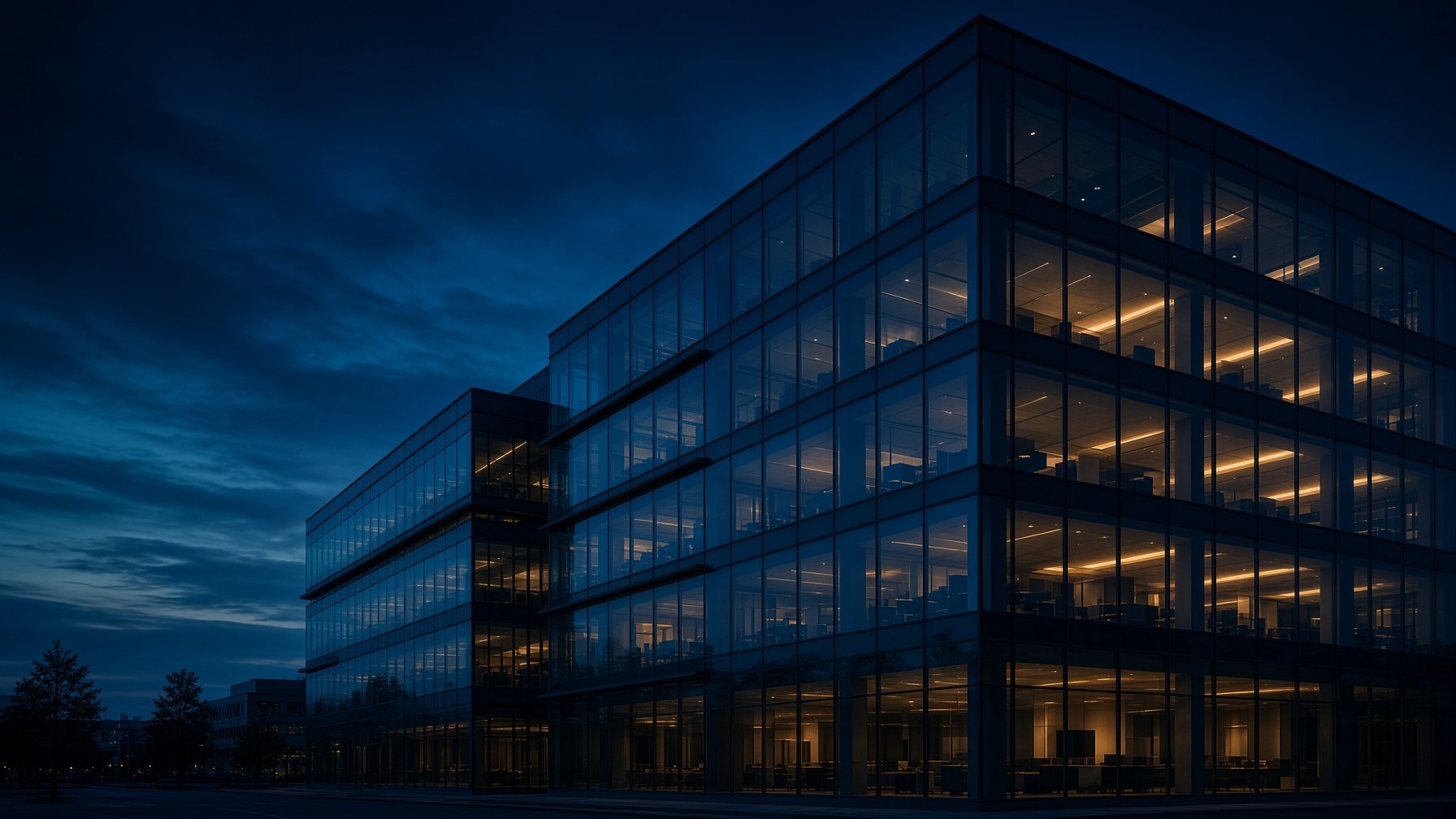 Glass office building at dusk