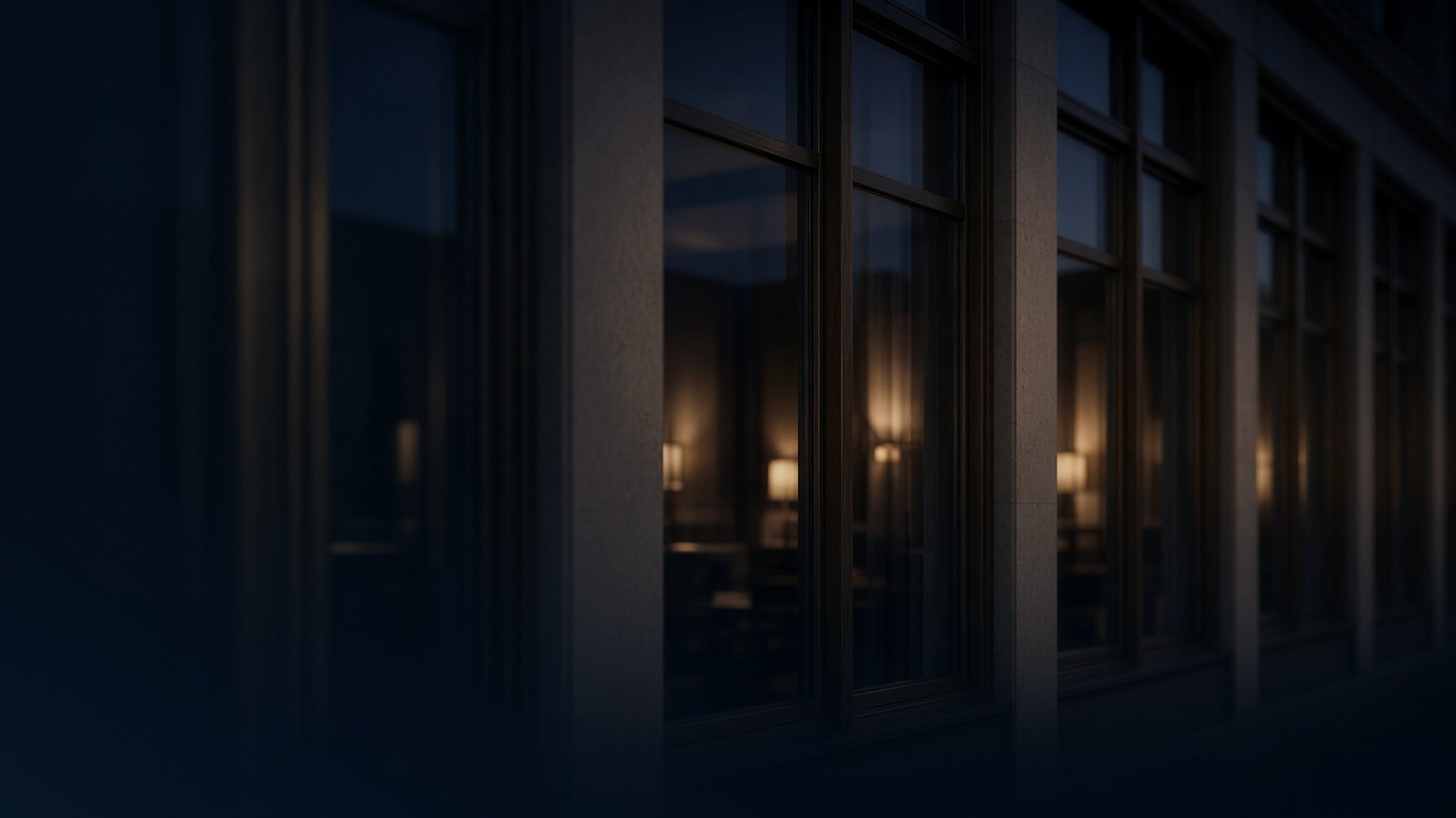 Dark architectural windows at dusk